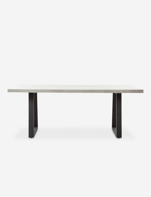 Hollis indoor and outdoor rectangular dining table featuring a white lava stone top and a sturdy black iron base