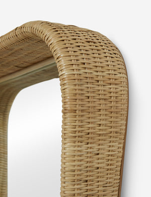 Close up of the frame of the Howell wicker frame floor mirror.