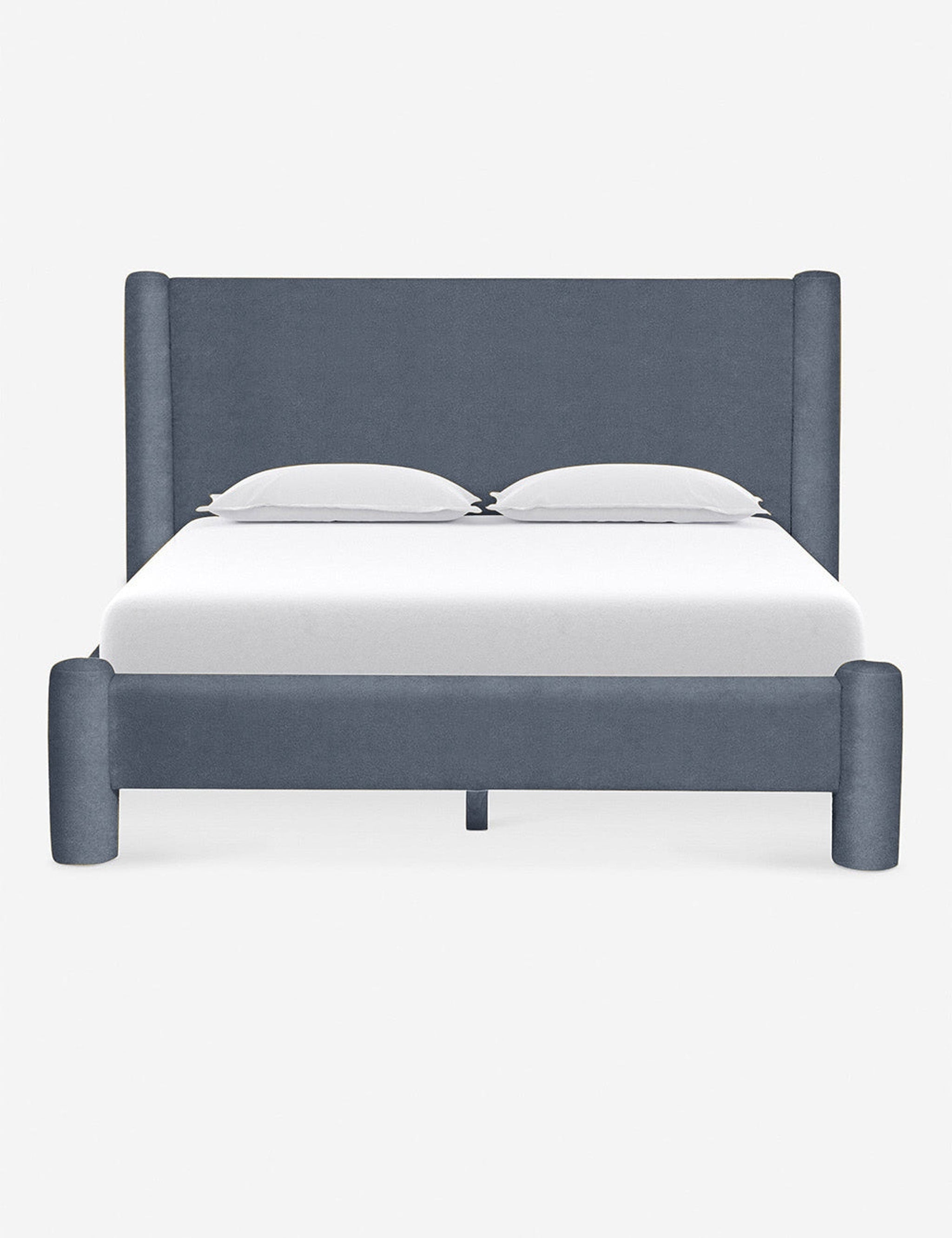 Front view of the Hyvaa upholstered king bed in denim blue velvet.