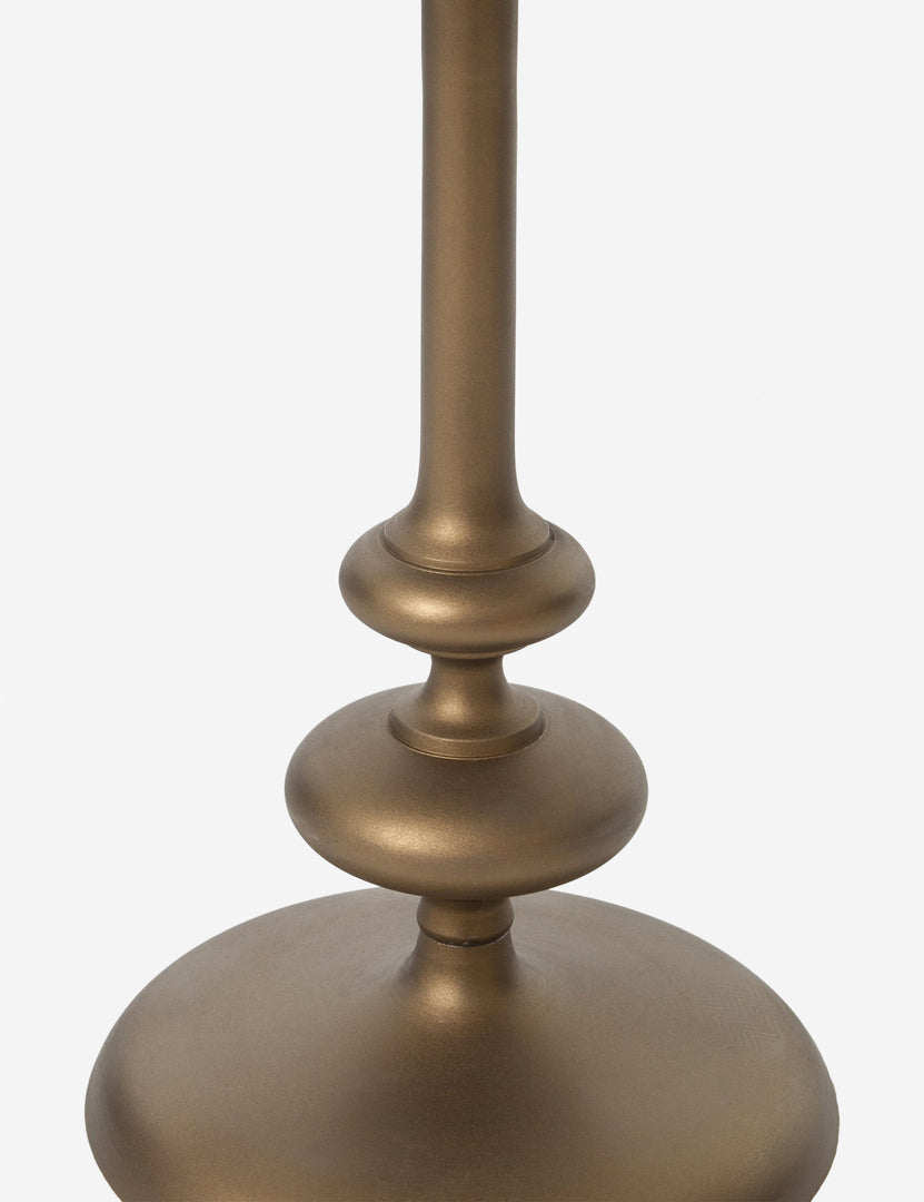#color::brass | Base of the Caratto round matte brass finish metal side table.