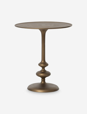 Caratto round matte brass finish metal side table.