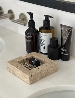 Teo catchall square tray in travertine used in a bathroom for storage