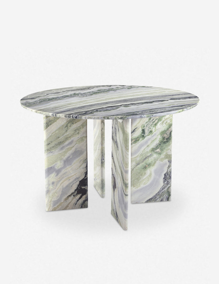 #color::green-onyx-marble | Angled view of the Celia sculptural round marble dining table.