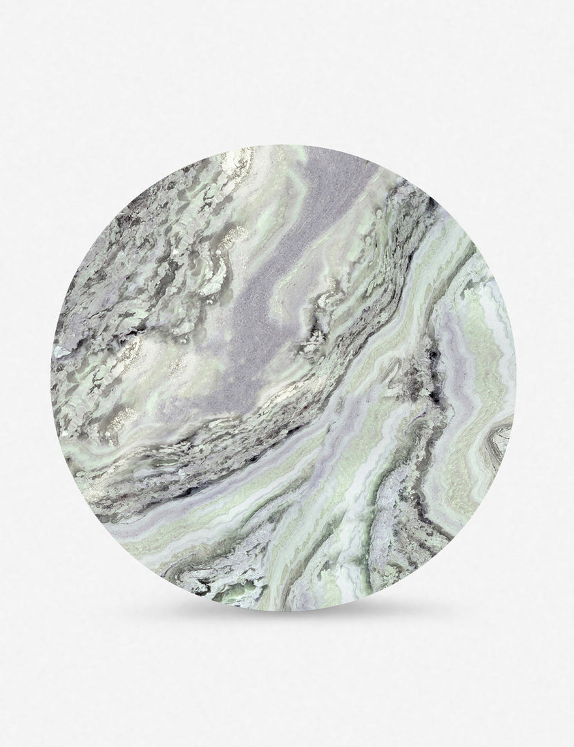 #color::green-onyx-marble | Top of the Celia sculptural round marble dining table.