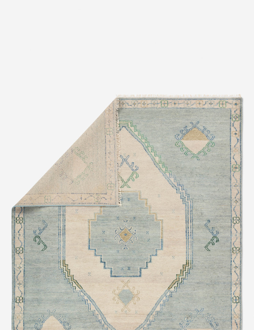 #size::6--x-9- #size::8--x-10- #size::9--x-12-#size::10--x-14- | Folded corner showing the back of the Berker turkish-inspired hand-knotted wool rug.