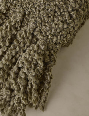 Close up of the Jaffe chunky knit fringed outdoor throw blanket in moss.