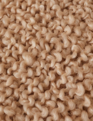 Close up of the Jaffe chunky knit fringed outdoor throw blanket in natural.