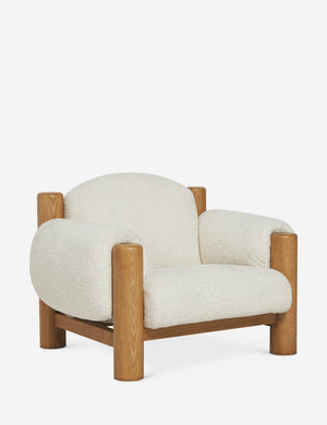 Angled view of the James faux sherpa accent chair