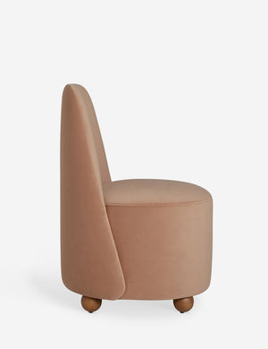 Side profile of the Judson modern round velvet dining chair.