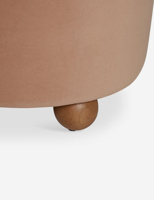 Wooden foot of the Judson modern round velvet dining chair.