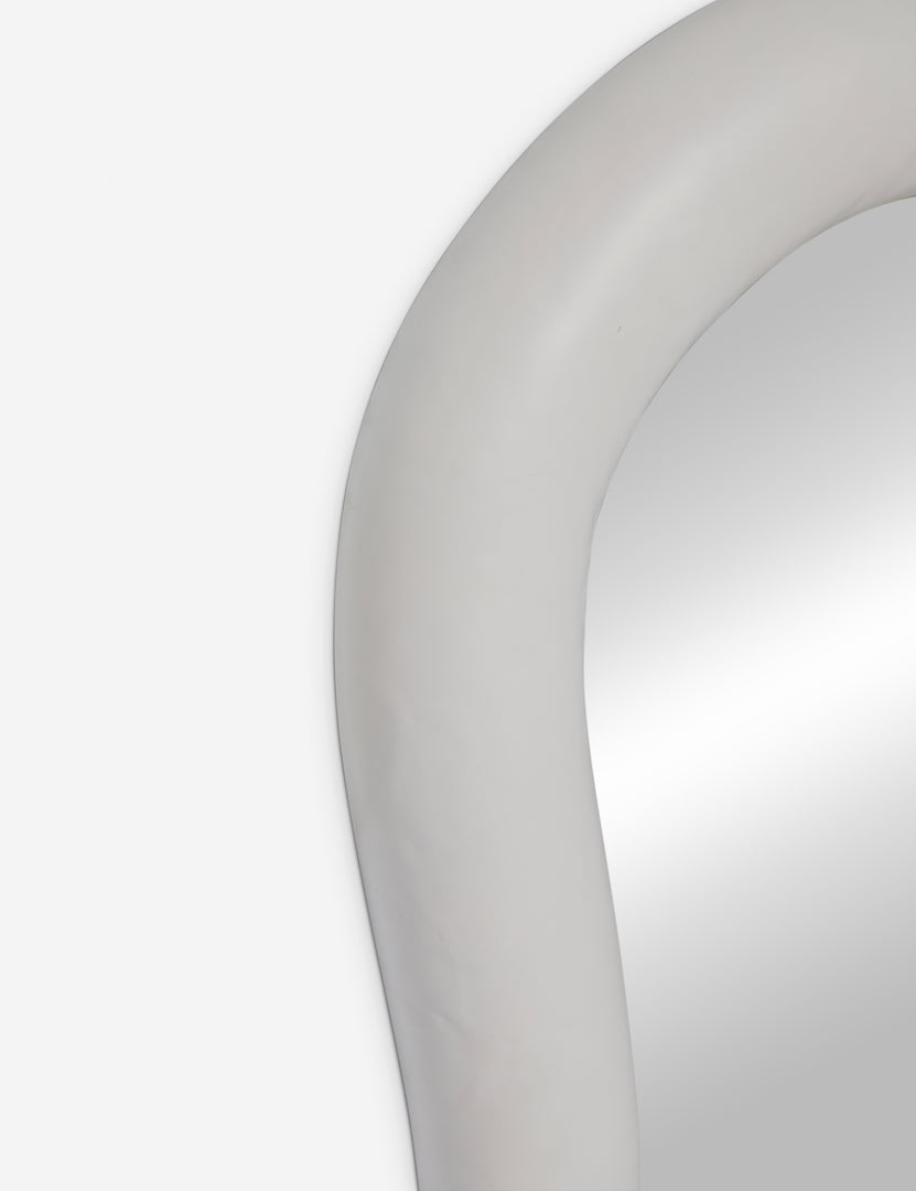 #color::white | Close up of the Junah organic oval shaped wall mirror in white