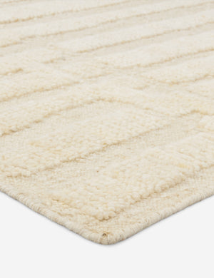 Close up view of the Pacheco hand-knotted wool ivory area rug.