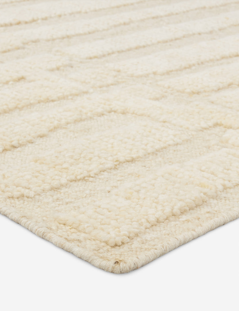 #size::6--x-9- #size::8--x-10- #size::9--x-12-#size::10--x-14- | Close up view of the Pacheco hand-knotted wool ivory area rug.
