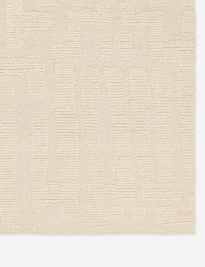 Corner of the Pacheco hand-knotted wool ivory area rug.