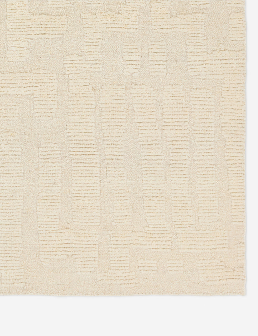 #size::6--x-9- #size::8--x-10- #size::9--x-12-#size::10--x-14- | Corner of the Pacheco hand-knotted wool ivory area rug.