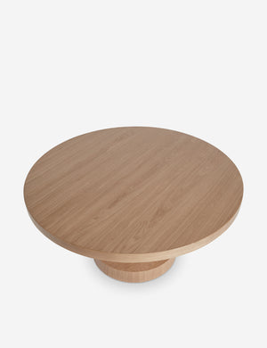 Overhead view of the Karine round natural wood pedestal dining table