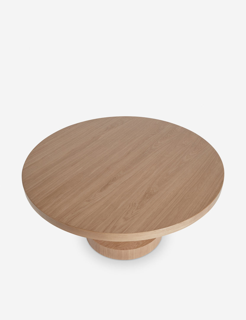 | Overhead view of the Karine round natural wood pedestal dining table