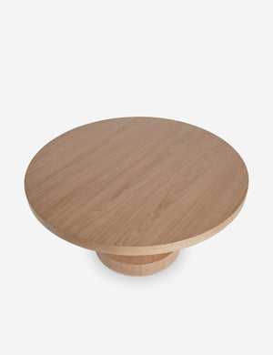 Overhead view of the Karine round natural wood pedestal dining table