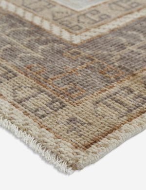 Angled close-up of the corner of the Kehoe desert palette geometric floor rug