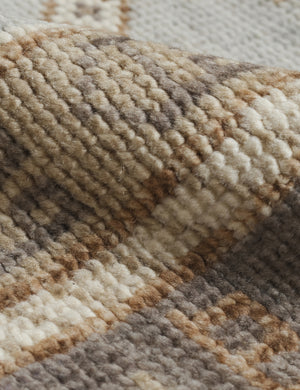 Detailed view of the pattern and woven texture on the Kehoe desert palette geometric floor rug