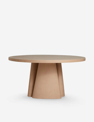 Side profile of the Keating sculptural round fiberstone outdoor dining table.
