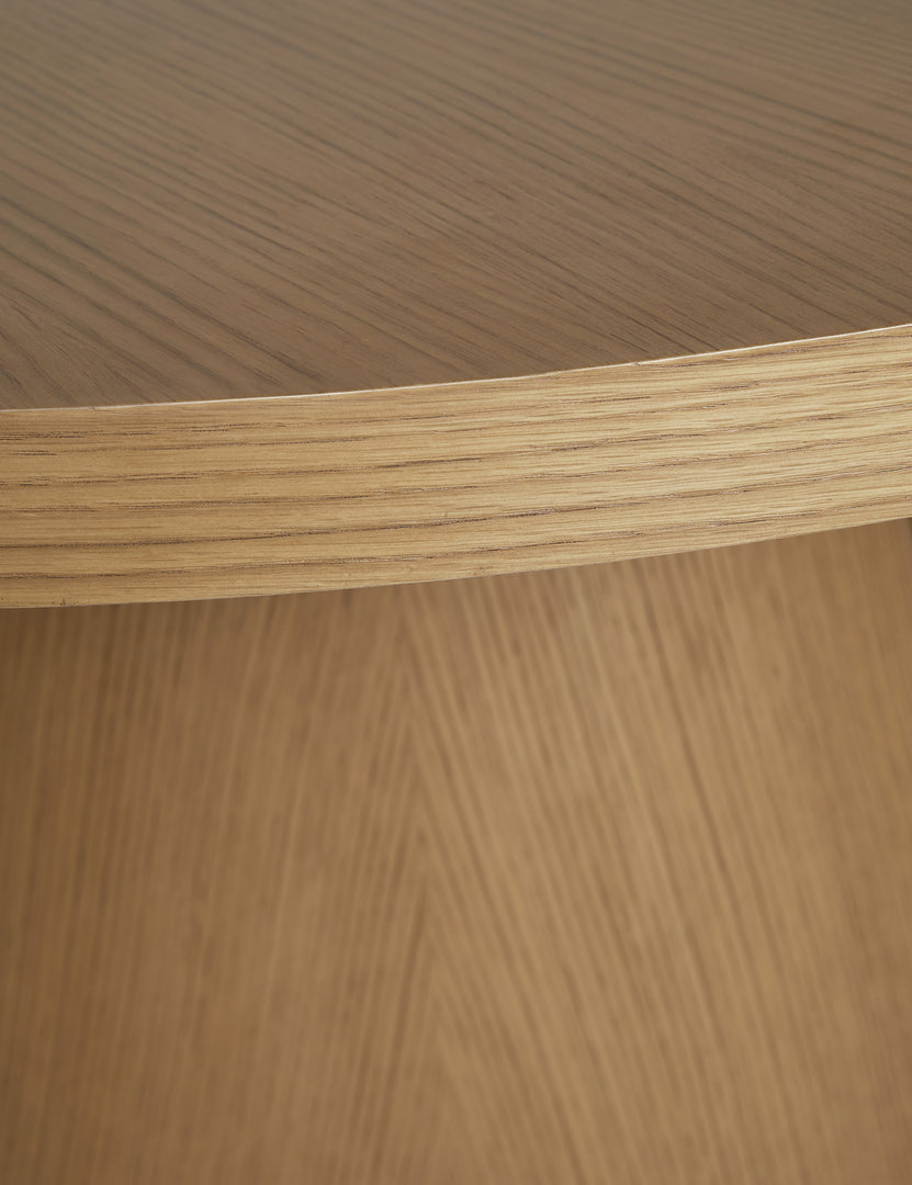 #color::russet | Close up of the Keating round geometric wood pedestal dining table.