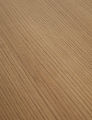 Close up of the Keating round geometric wood pedestal dining table.