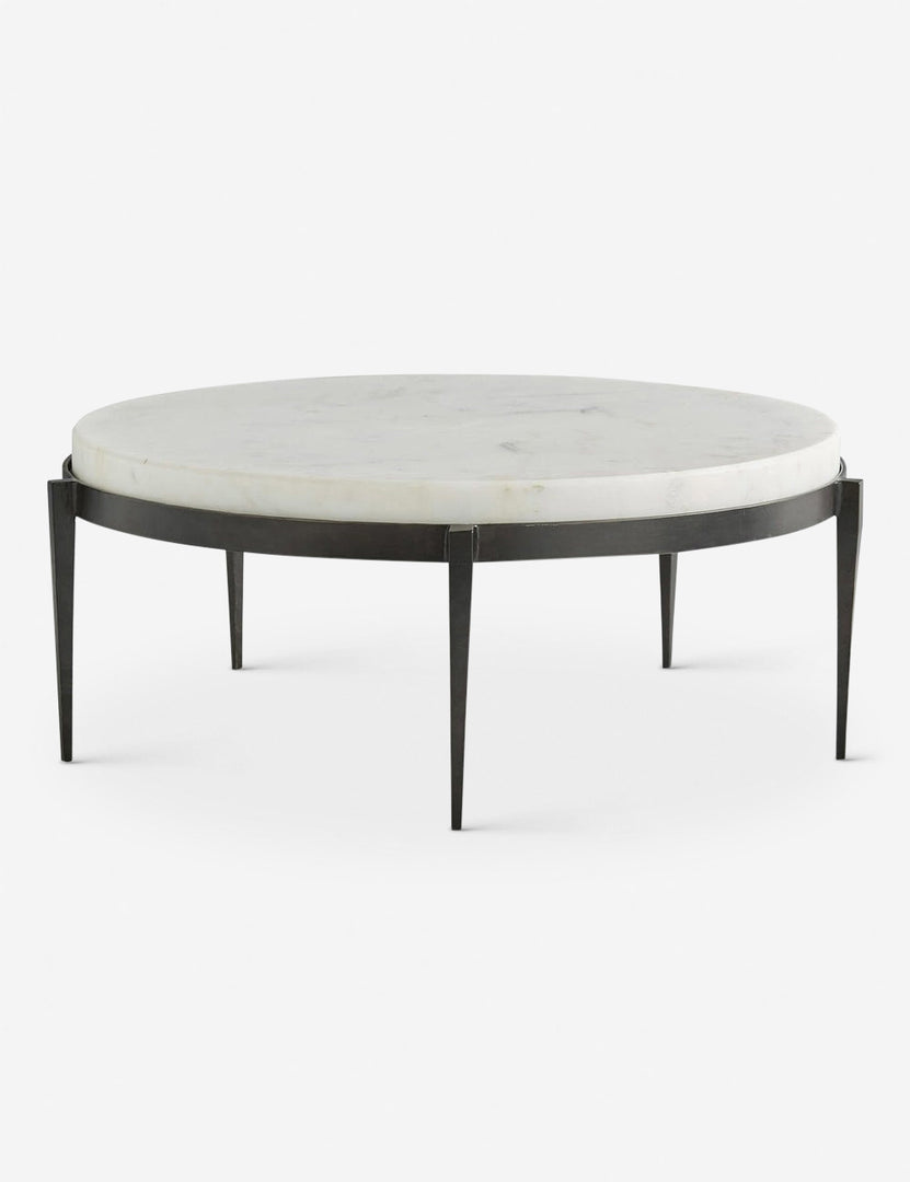 | Kelsie round coffee table by Arteriors with white marble top and black five-leg base