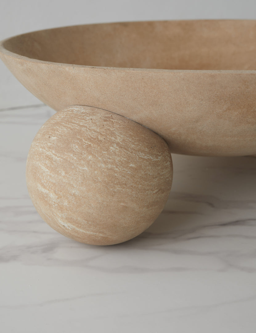 #color::natural | Close up of the bottom of the Kester sculptural footed decorative bowl.
