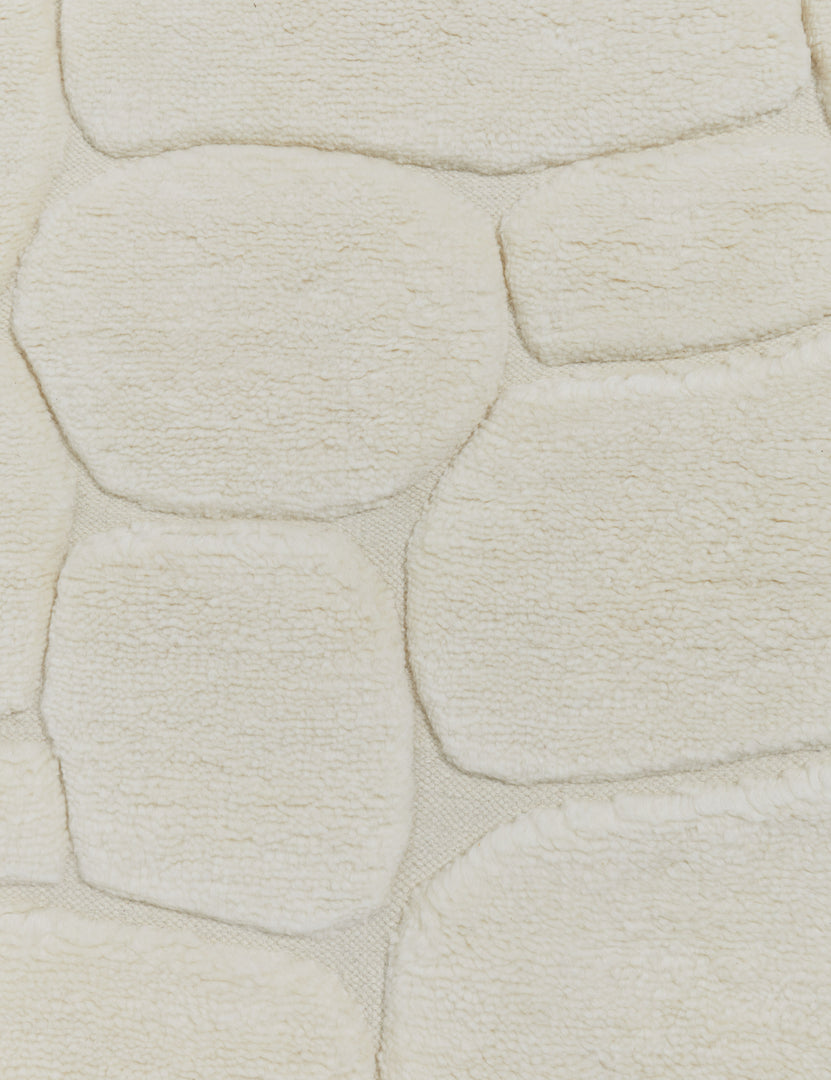 #size::6--x-9- #size::8--x-10- #size::9--x-12- #size::10--x-14- #size::12--x-15- | Close up view of the Kivi raised cobblestone pattern fringe wool area rug