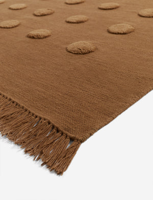 Corner of the Kohta high-low pile dot design wool area rug in camel