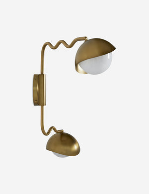 Angled view of the Kukka modern wavy adjustable two arm wall sconce in brass