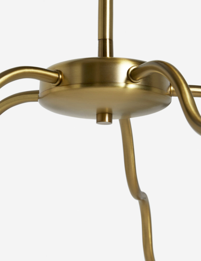 #color::brass #size::62-dia | Close up view of the Kukka large modern wavy arm chandelier in brass