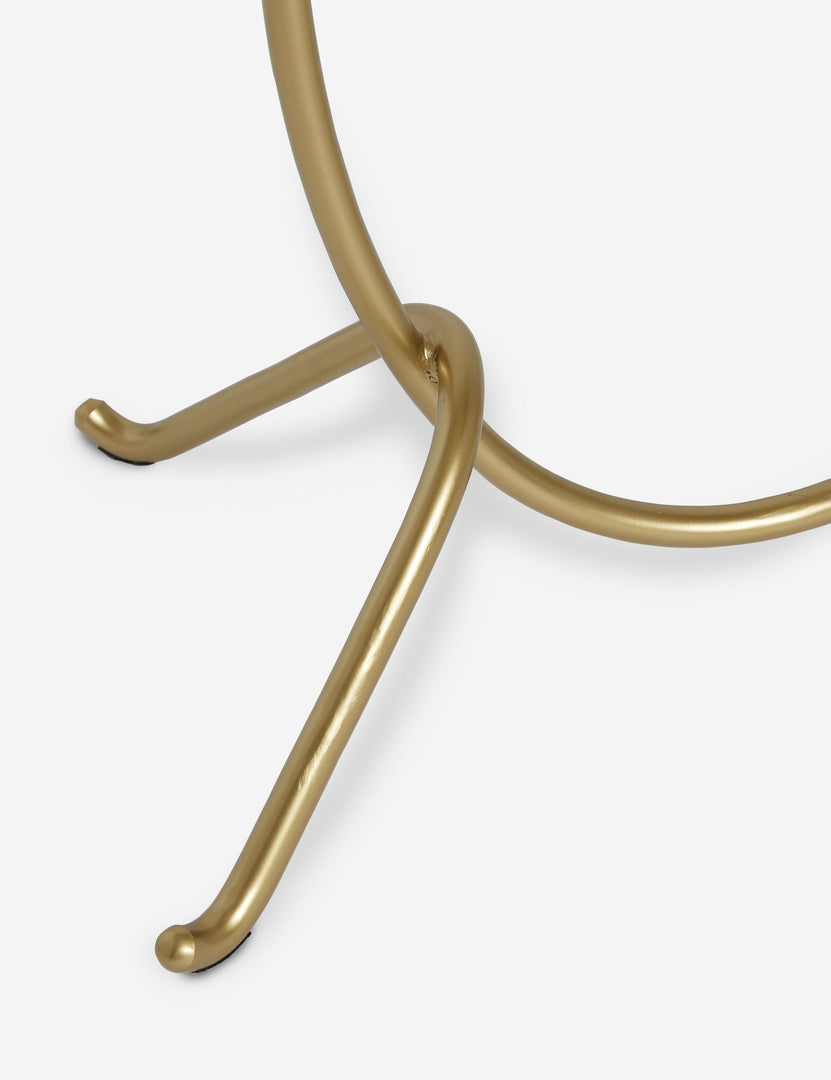 #color::brass | Close up view of the base of the Kukka modern two light wavy base floor lamp in brass