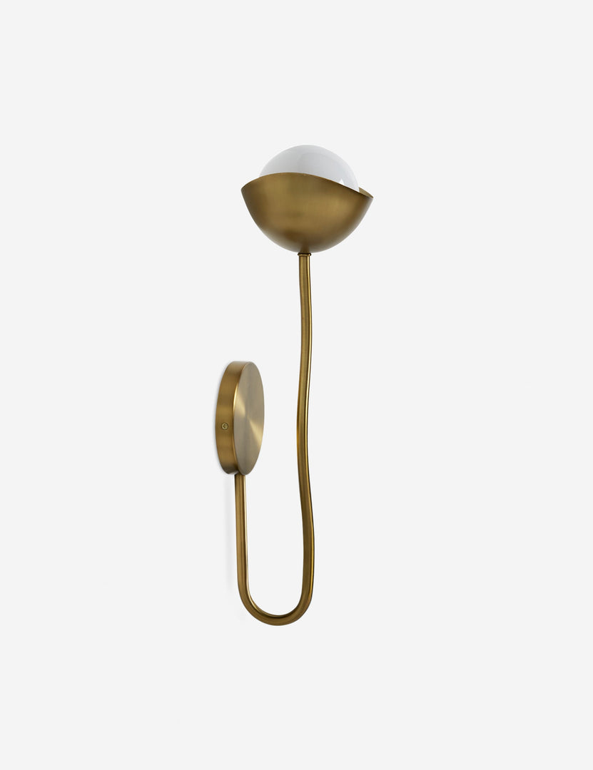 #color::brass | Side view of the Kukka modern wavy arm wall sconce in brass