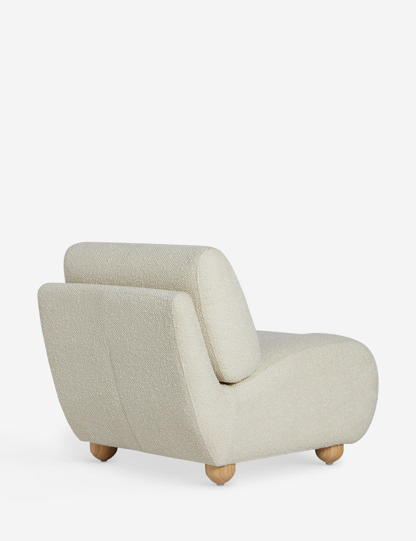 #color::ivory-basket-boucle | Angled back view of the Kya textural boucle armless accent chair.