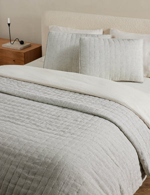 Lammin striped quilted linen coverlet in black and ivory stripe
