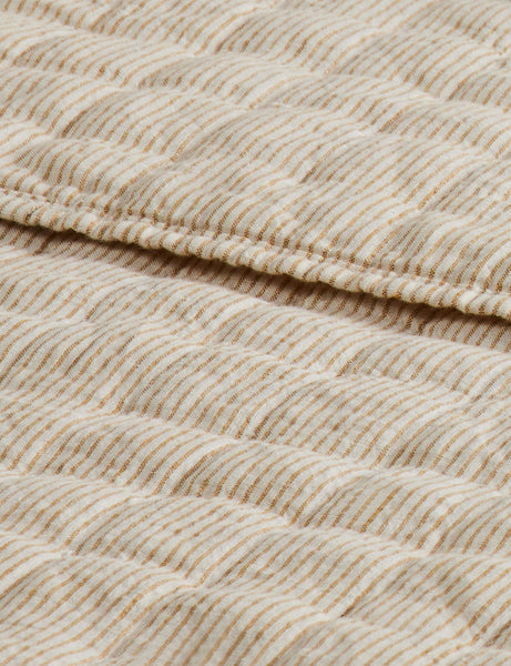 #color::goldenrod-and-ivory #size::full-queen #size::king-cal-king | Close up of the Lammin striped quilted linen coverlet in goldenrod and ivory