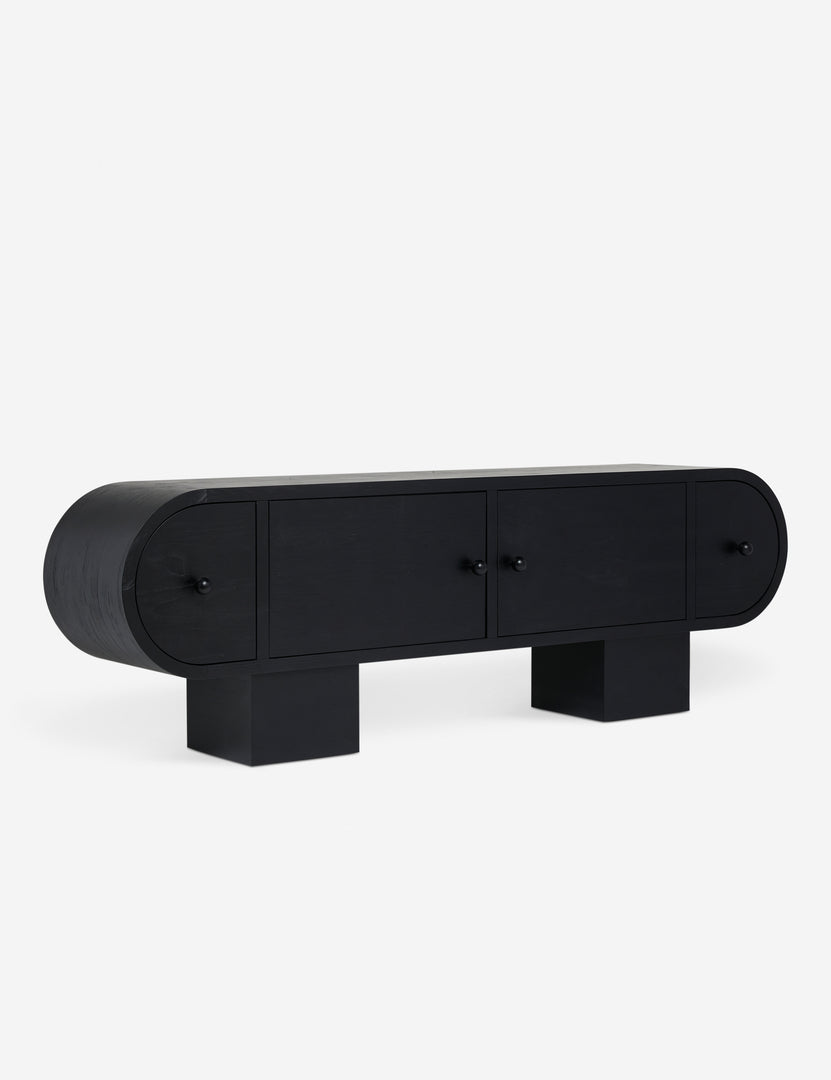 | Angled view of the Laughlin retro pill shaped sideboard cabinet in black