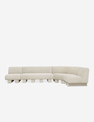 Lena right-facing white boucle sectional sofa with upholstered beam legs.