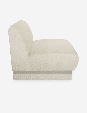 Side view of the Centerpiece of the white boucle sectional sofa with upholstered beam legs