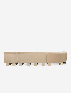 Rear view of the side of the Lena left-facing beige velvet sectional sofa with upholstered beam legs.