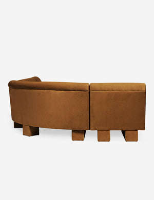Rear view of the side of the Lena right-facing cognac velvet sectional sofa with upholstered beam legs.