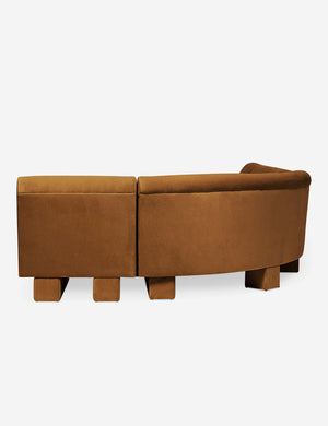 Rear view of the side of the Lena left-facing cognac velvet sectional sofa with upholstered beam legs.