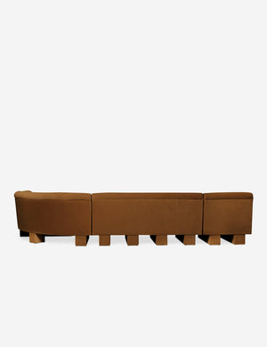 Rear view of the entire Lena right-facing cognac velvet sectional sofa with upholstered beam legs.