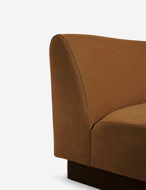 Close-up of the Centerpiece of the Lena cognac velvet sectional sofa with upholstered beam legs