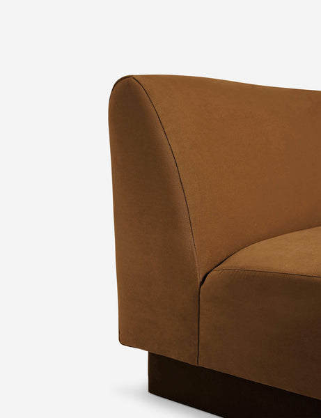 #color::Cognac-velvet #configuration::left-facing #configuration::right-facing #size::142-W #size::114-W | Close-up of the Centerpiece of the Lena cognac velvet sectional sofa with upholstered beam legs
