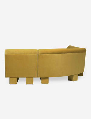 Rear view of the side of the Lena left-facing yellow velvet sectional sofa with upholstered beam legs.