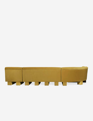 Rear view of the entire Lena left-facing yellow velvet sectional sofa with upholstered beam legs.