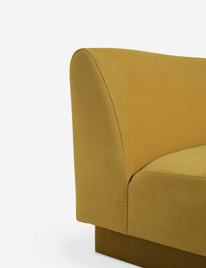 Side view of the Centerpiece of the Lena yellow velvet sectional sofa with upholstered beam legs